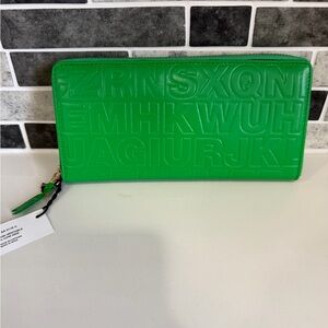 Comme des Garçons Embossed Alphabet Zip Wallet in Bright Green
